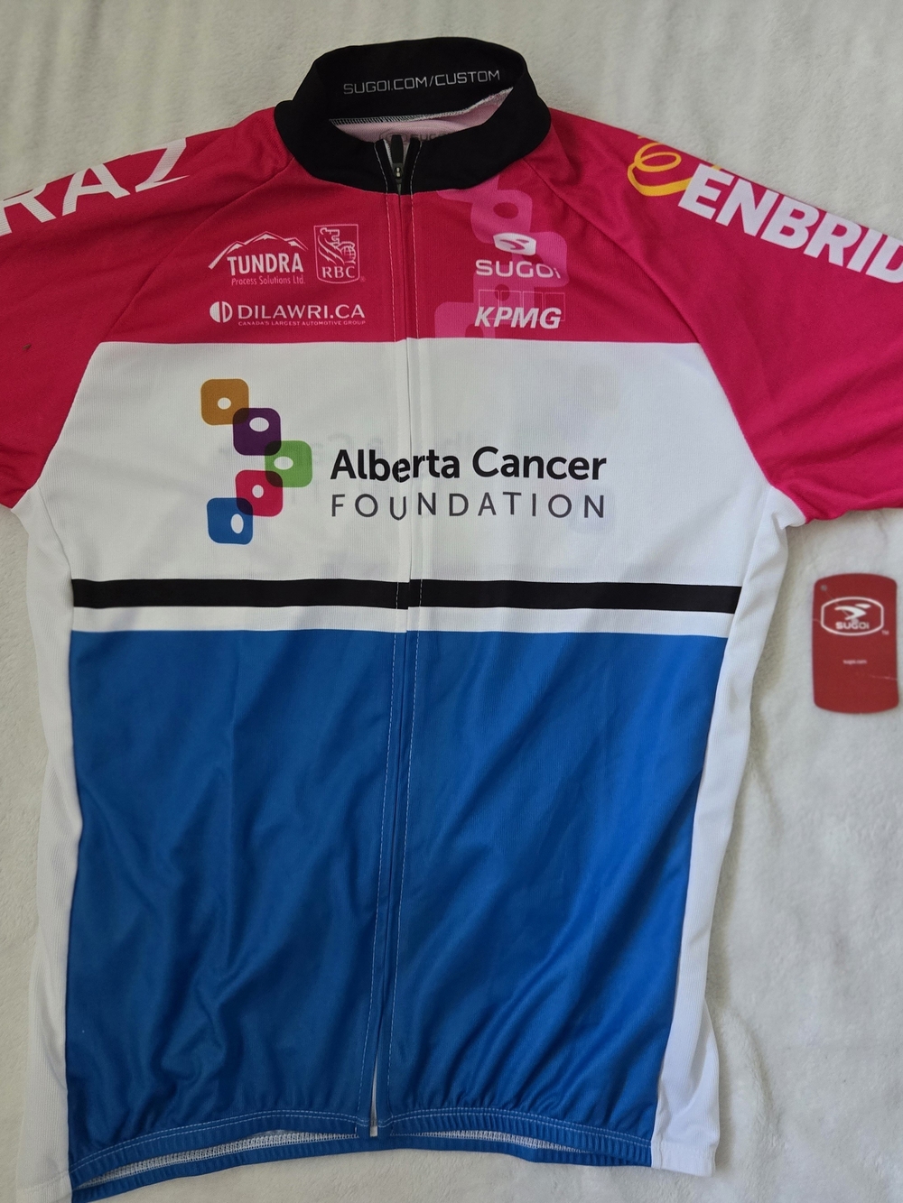 SUGOI Women's Cycling Jersey in Pink, Blue & White - Alberta Cancer Foundation